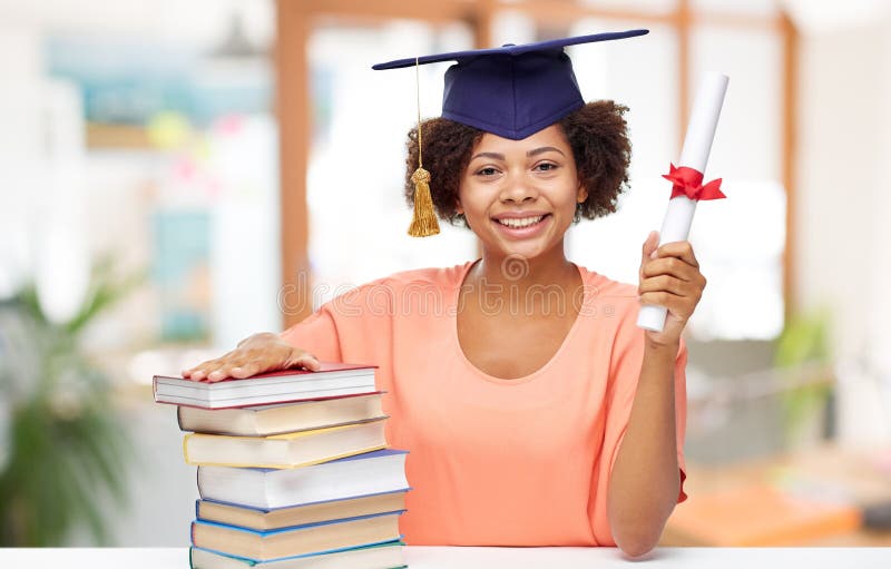 African graduate student with books and diploma royalty free stock image African graduate student with books and diploma royalty free stock image