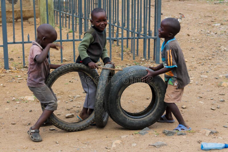 African Little Children Playing with Wheels Editorial Image - Image of  playing, fence: 116521095