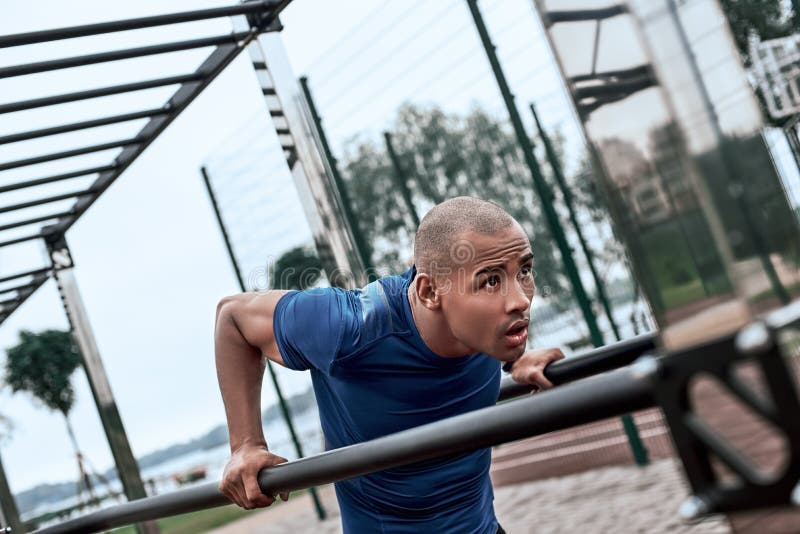 An African Man is Exercising at Open Air Gym Stock Image - Image of ...