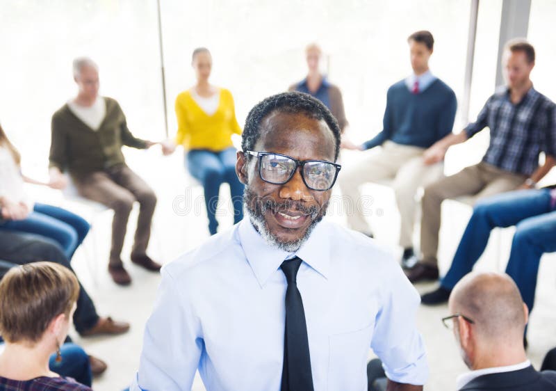 African Man Standing in Front of a Support Group royalty free stock photography African Man Standing in Front of a Support Group royalty free stock photography