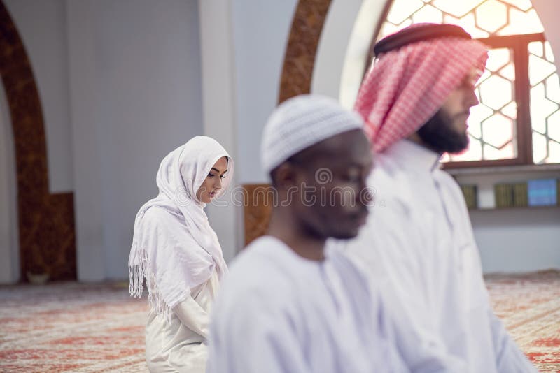 African Muslim Couple Praying inside of beutiful mosque stock photos
