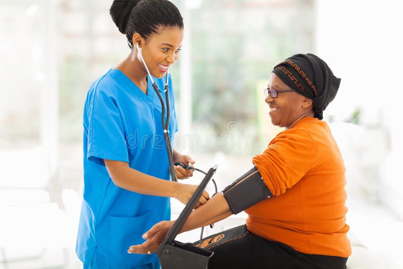 African nurse checking blood pressure