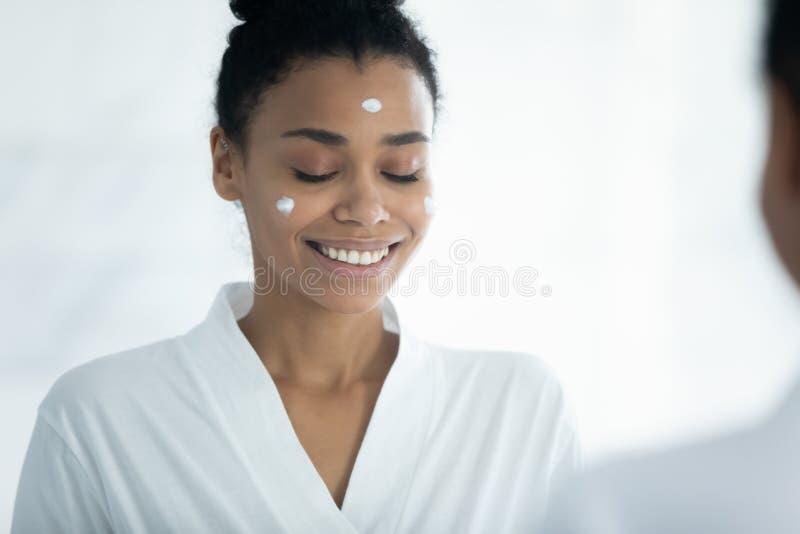 African Woman Applied Facial Cream Doing Skincare Procedures At Home Stock Image Image Of