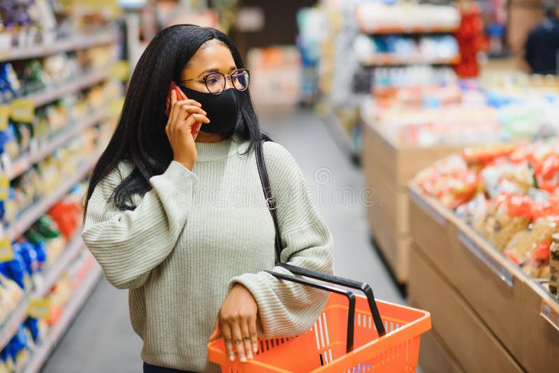 African Woman Wearing Disposable Medical Mask Shopping in Supermarket ...