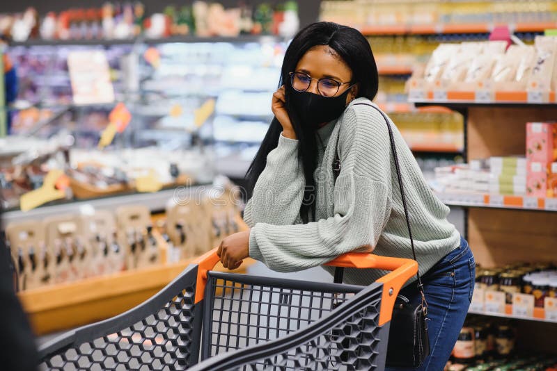 African Woman Wearing Disposable Medical Mask. Shopping in Supermarket ...