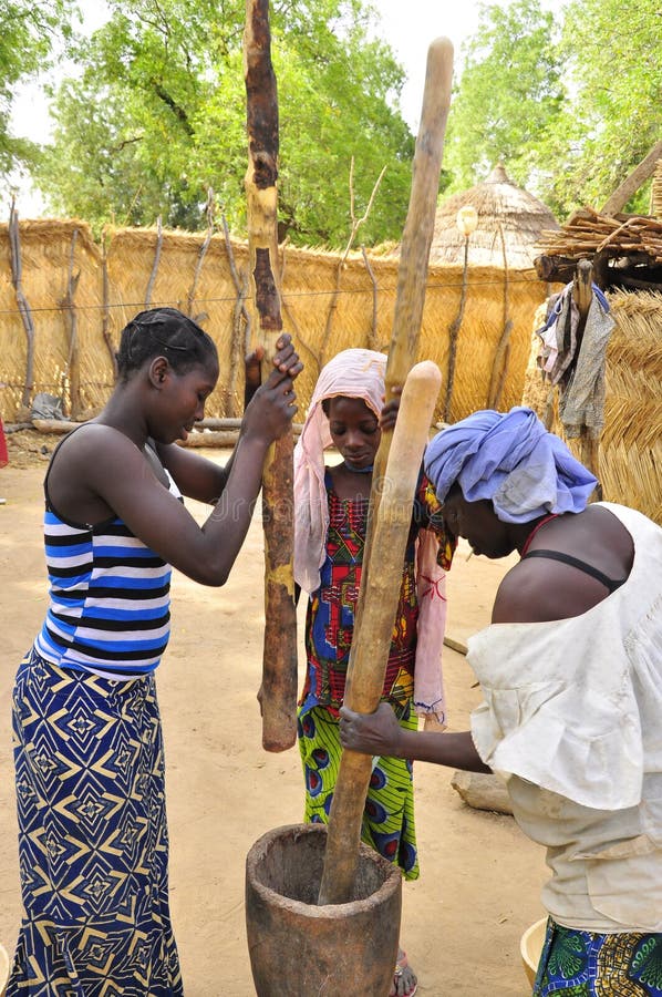 AFRICAN women at work preparing food