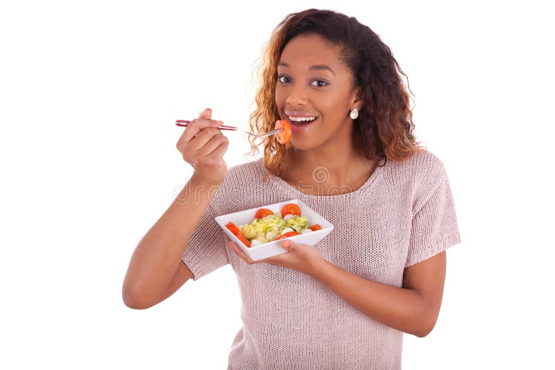 African American woman eating salad, isolated on white background - Black people. African American woman eating salad, isolated on white background - Black people