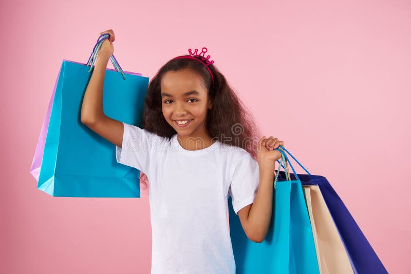 Afro American girl in sham crown holds paper royalty free stock photo Afro American girl in sham crown holds paper royalty free stock photo