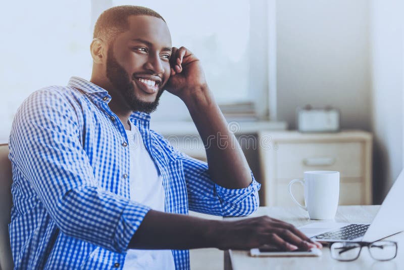Afro-american Young Man Sitting and Thinking. royalty free stock photo Afro-american Young Man Sitting and Thinking. royalty free stock photo
