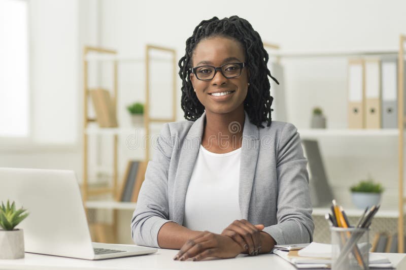 Afro Business Lady Smiling At Camera Sitting At Workplace