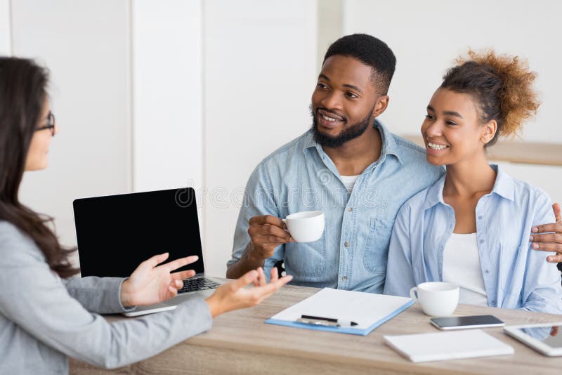 Afro Couple Attending Home Buying Consultation In Real Estate Agency