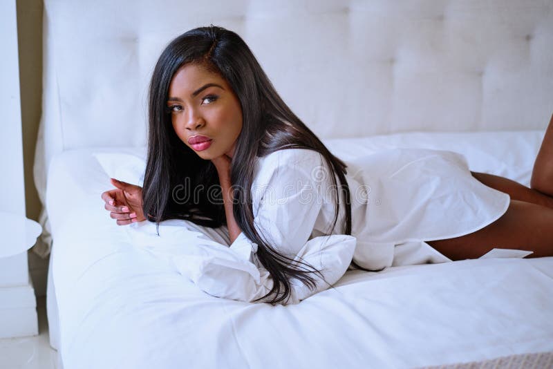 Afro girl lying on bed stock image. Image of pretty - 157835183