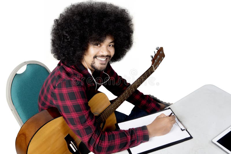 Afro man listening music with guitar