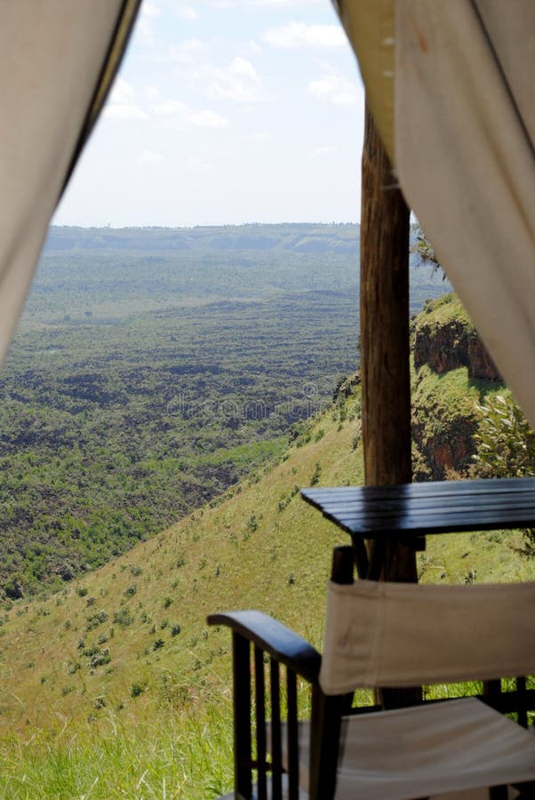 AFRICA, KENYA, AUGUST 3,  2010: Views from inside the bungalow, vacations in the african mountains. African holidays chilling in the resort. AFRICA, KENYA, AUGUST 3,  2010: Views from inside the bungalow, vacations in the african mountains. African holidays chilling in the resort