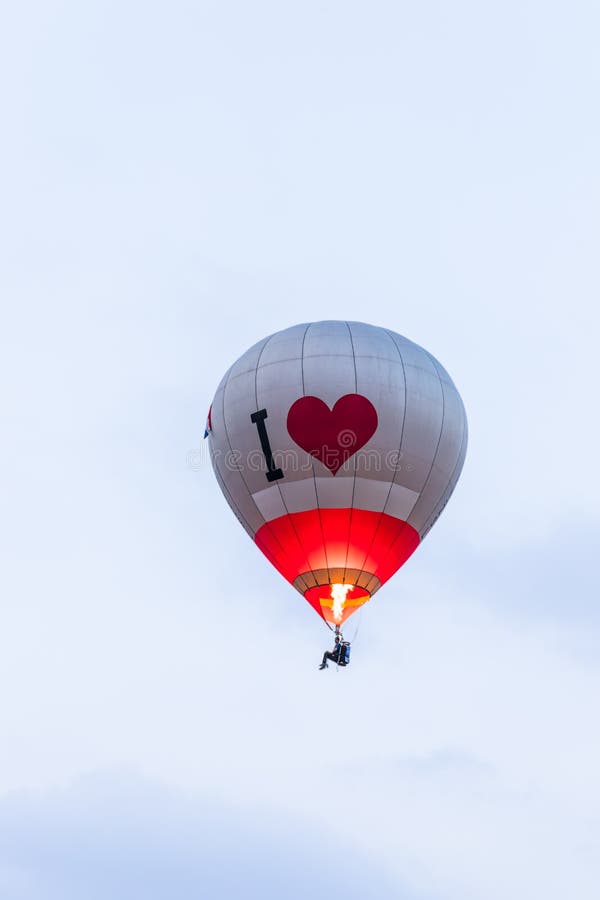 In the sky red - gray hot air balloon at the hot air balloon festival royalty free stock photos In the sky red - gray hot air balloon at the hot air balloon festival royalty free stock photos