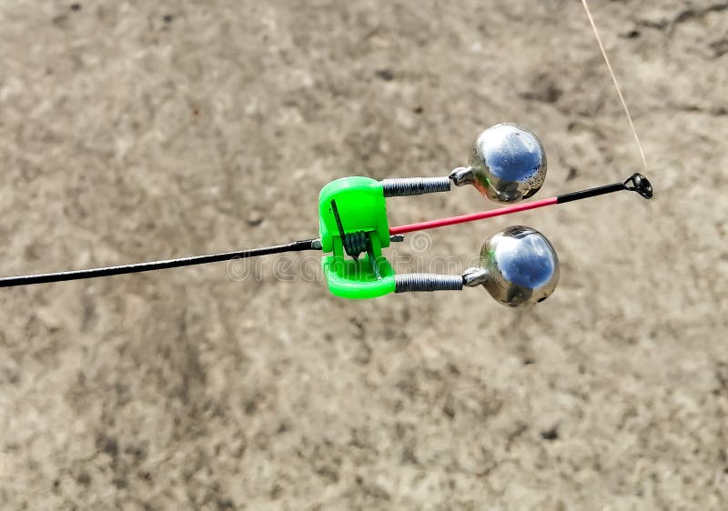 Fishing Bell at the End of a Fishing Rod. Bells Will Ring when the