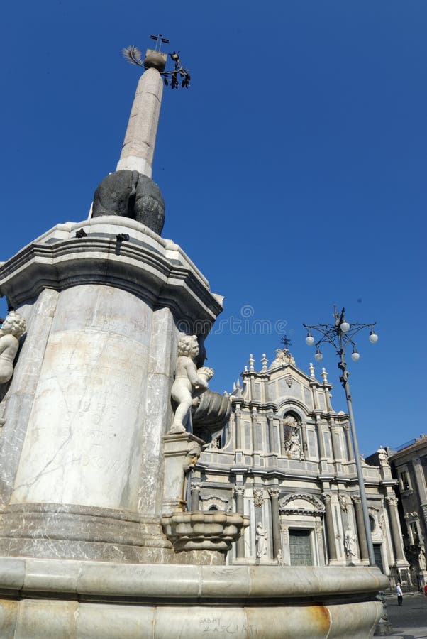 Catania the obelisk of the fountain of the elephant and the cathedral of Santa Agata in square of the Duomo. Catania the obelisk of the fountain of the elephant and the cathedral of Santa Agata in square of the Duomo