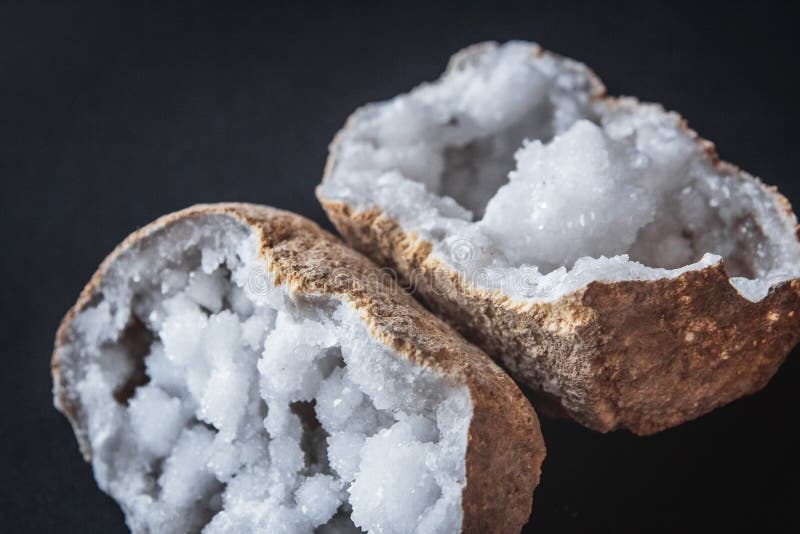 Agate. A cross section of agate stone with geode on a black background. Origin: Morocco, Sidi Rachal royalty free stock image