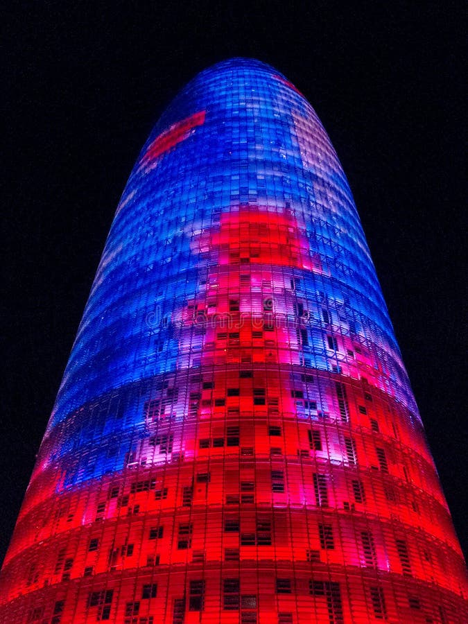 Blue and Red Agbar Tower in Barcelona at night 0452