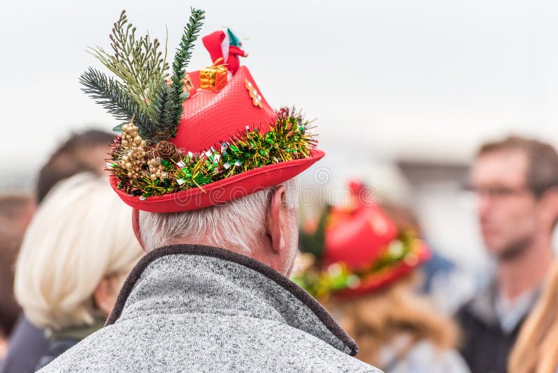 AGDE, FRANCE - SEPTEMBER 9, 2017: A man in a New Year`s hat at an exhibition of retro cars Volkswagen. Close-up. AGDE, FRANCE - SEPTEMBER 9, 2017: A man in a stock photos AGDE, FRANCE - SEPTEMBER 9, 2017: A man in a New Year`s hat at an exhibition of retro cars Volkswagen. Close-up. AGDE, FRANCE - SEPTEMBER 9, 2017: A man in a stock photos