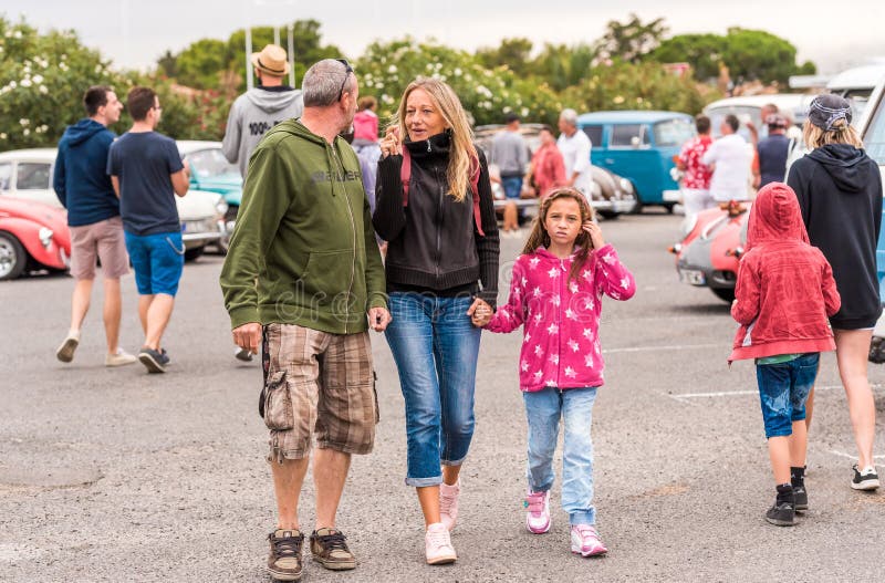 AGDE, FRANCE - SEPTEMBER 9, 2017: People at the exhibition of retro cars Volkswagen Cap d`Agde. Copy space for text. AGDE, FRANCE - SEPTEMBER 9, 2017: People at royalty free stock image AGDE, FRANCE - SEPTEMBER 9, 2017: People at the exhibition of retro cars Volkswagen Cap d`Agde. Copy space for text. AGDE, FRANCE - SEPTEMBER 9, 2017: People at royalty free stock image