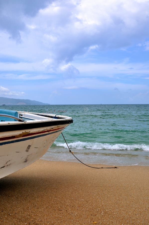 Aged boat on beach