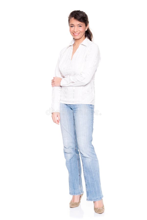 Middle aged woman standing in front of white background. Middle aged woman standing in front of white background