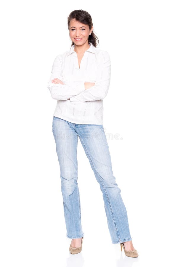 Middle aged woman standing in front of white background. Middle aged woman standing in front of white background