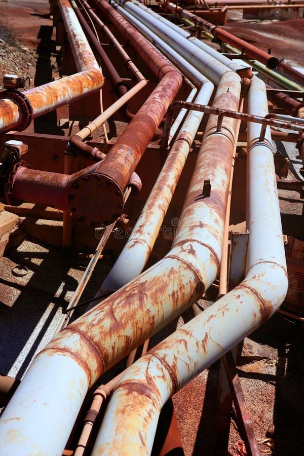 Aged rusty grunge industrial pipe lines stock photography