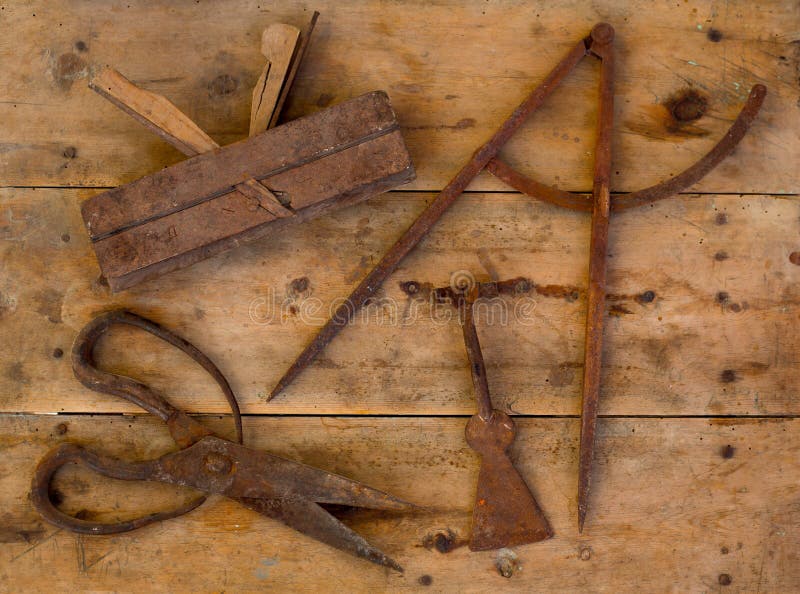 Aged tools wood planer wool scissors drawing compass royalty free stock photography