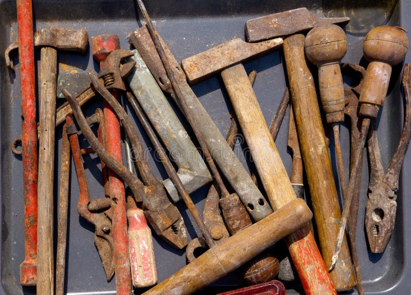 Aged weathered rusty hand tools in black royalty free stock photos