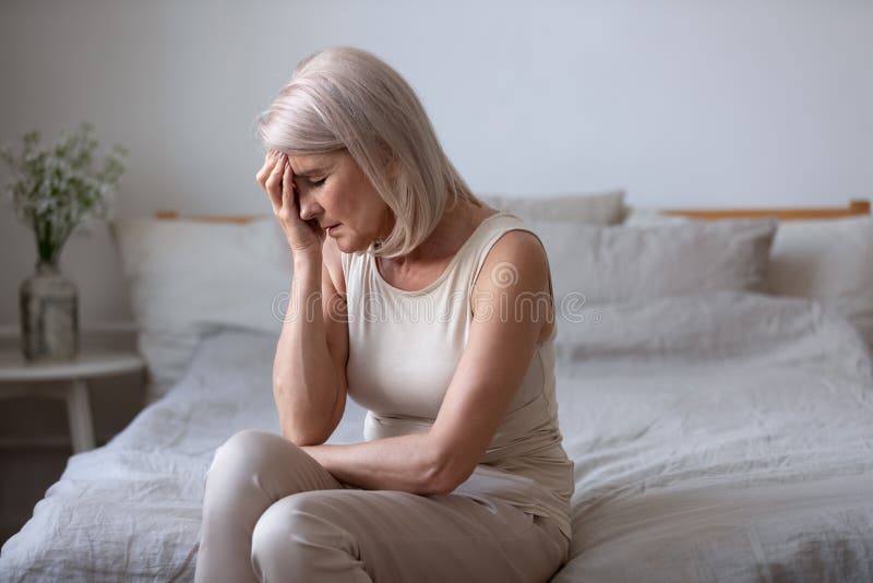 Aged woman feels unwell suffers from barometric pressure headache