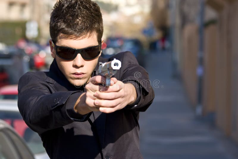 Agent with gun