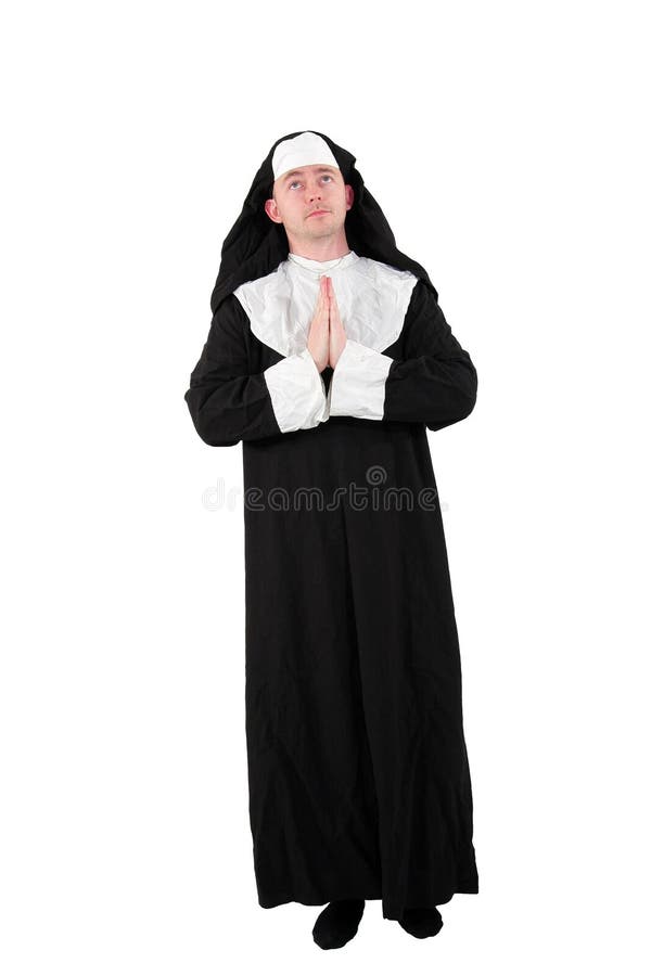 A male actor in a nunÂ´s costume with praying hands and a view to the sky, isolated on white background. A male actor in a nunÂ´s costume with praying hands and a view to the sky, isolated on white background