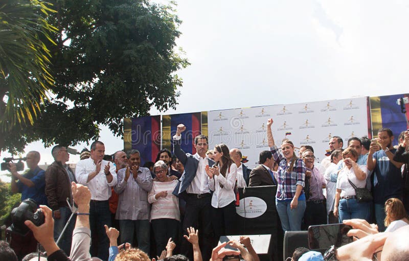 Caracas, Venezuela - January 11, 2019: President of the National Assembly and Interim president of Venezuela Juan Guaidó next to his wife speaking at Town meeting in Caracas, Venezuela. Caracas, Venezuela - January 11, 2019: President of the National Assembly and Interim president of Venezuela Juan Guaidó next to his wife speaking at Town meeting in Caracas, Venezuela