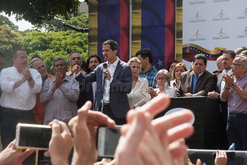 Caracas, Venezuela - January 11, 2019: President of the National Assembly and Interim president of Venezuela Juan Guaidó next to his wife speaking at Town meeting in Caracas, Venezuela. Caracas, Venezuela - January 11, 2019: President of the National Assembly and Interim president of Venezuela Juan Guaidó next to his wife speaking at Town meeting in Caracas, Venezuela