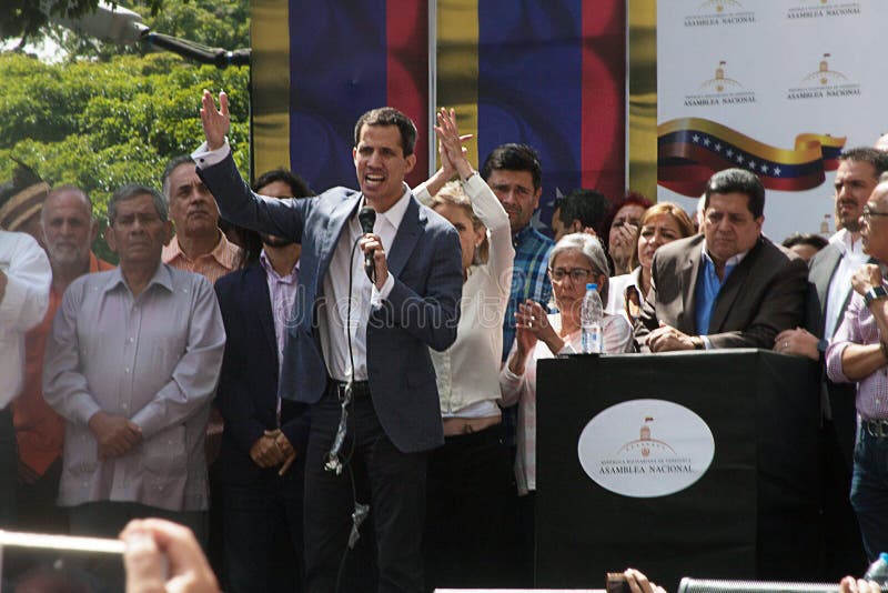 Caracas, Venezuela - January 11, 2019: President of the National Assembly and Interim president of Venezuela Juan Guaidó next to his wife speaking at Town meeting in Caracas, Venezuela. Caracas, Venezuela - January 11, 2019: President of the National Assembly and Interim president of Venezuela Juan Guaidó next to his wife speaking at Town meeting in Caracas, Venezuela