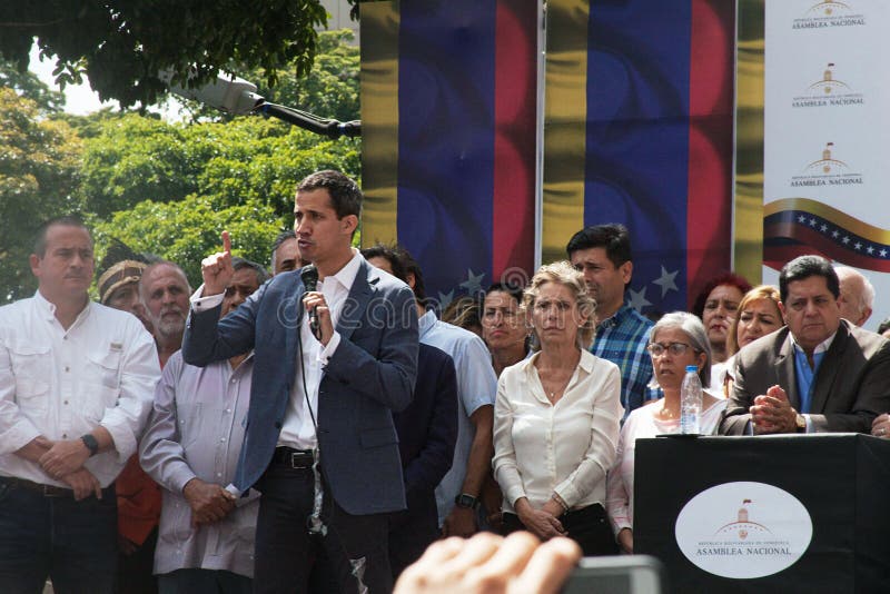 Caracas, Venezuela - January 11, 2019: President of the National Assembly and Interim president of Venezuela Juan Guaidó next to his wife speaking at Town meeting in Caracas, Venezuela. Caracas, Venezuela - January 11, 2019: President of the National Assembly and Interim president of Venezuela Juan Guaidó next to his wife speaking at Town meeting in Caracas, Venezuela