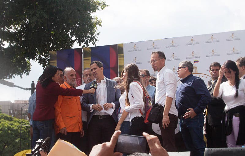 Caracas, Venezuela - January 11, 2019: President of the National Assembly and Interim president of Venezuela Juan Guaidó next to his wife speaking at Town meeting in Caracas, Venezuela. Caracas, Venezuela - January 11, 2019: President of the National Assembly and Interim president of Venezuela Juan Guaidó next to his wife speaking at Town meeting in Caracas, Venezuela