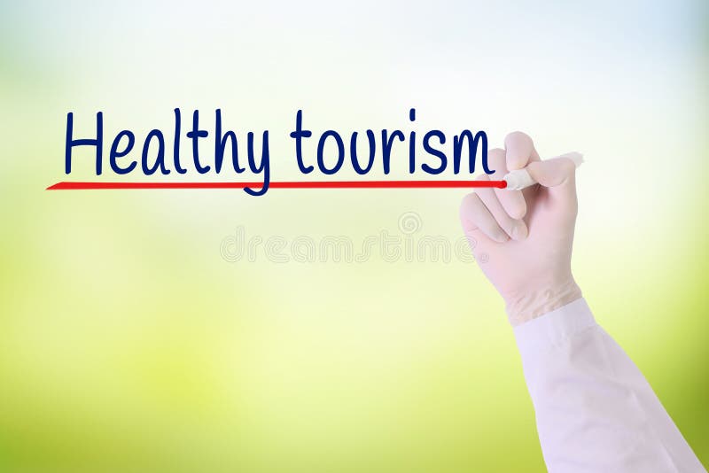 Aggiusti la mano con turismo di salute di scrittura del guanto sopra fondo vago verde fotografia stock libera da diritti Aggiusti la mano con turismo di salute di scrittura del guanto sopra fondo vago verde fotografia stock libera da diritti