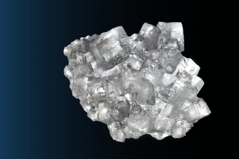 Cubic Salt Crystal Aggregate Against Black Background Stock Photo