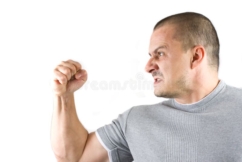 Aggressive man showing his fist isolated on white