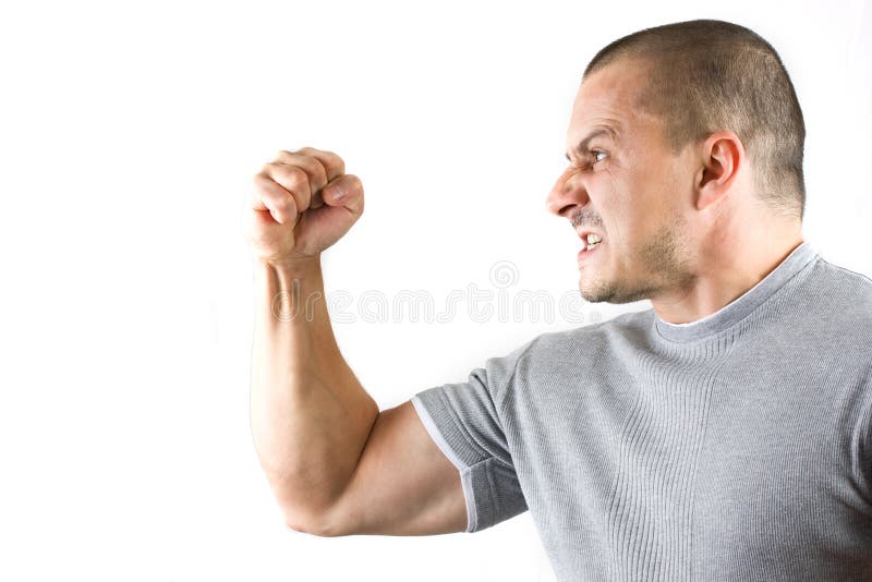 Aggressive man showing his fist isolated on white