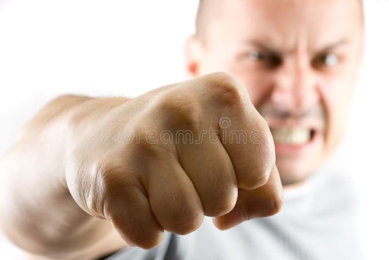 Aggressive man showing his fist isolated on white