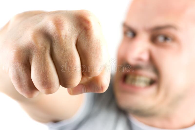 Aggressive man showing his fist isolated on white