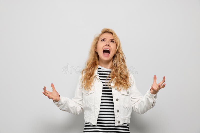 Aggressive Young Woman Screaming with Rage on White Background Stock ...