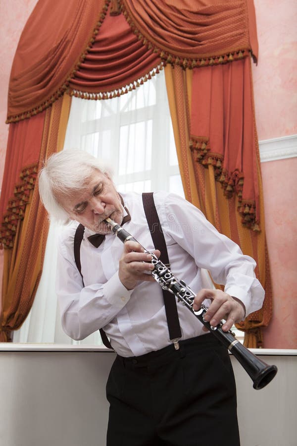 Aging Musician Plays the Stock Photo Image of elegant