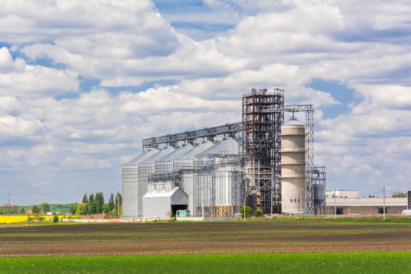 Agricultural Enterprise a New Complex of Granaries and Fields of Agricultural Crops Stock Image
