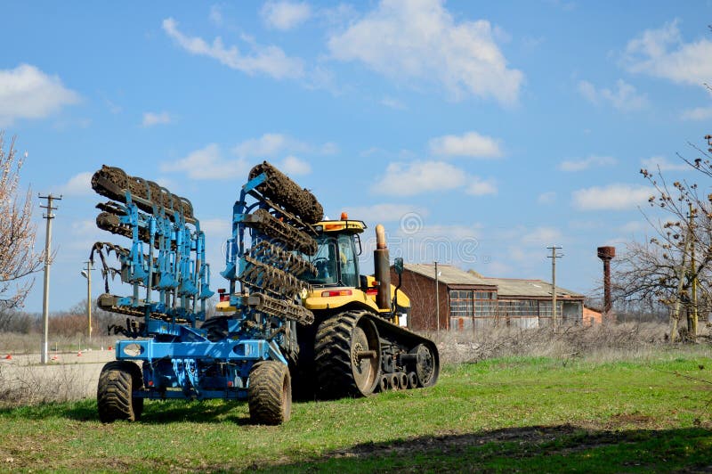 Agricultural tractor with equipment for working in field