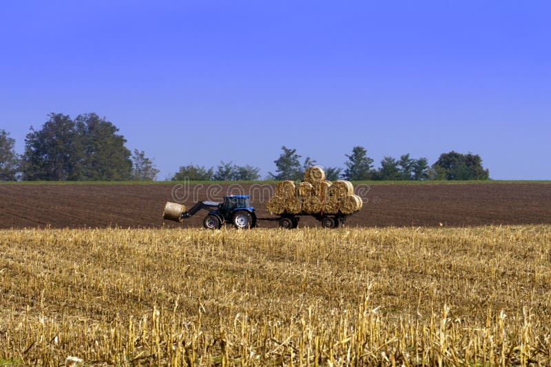 Agricultural tractor working in the field. stock photography